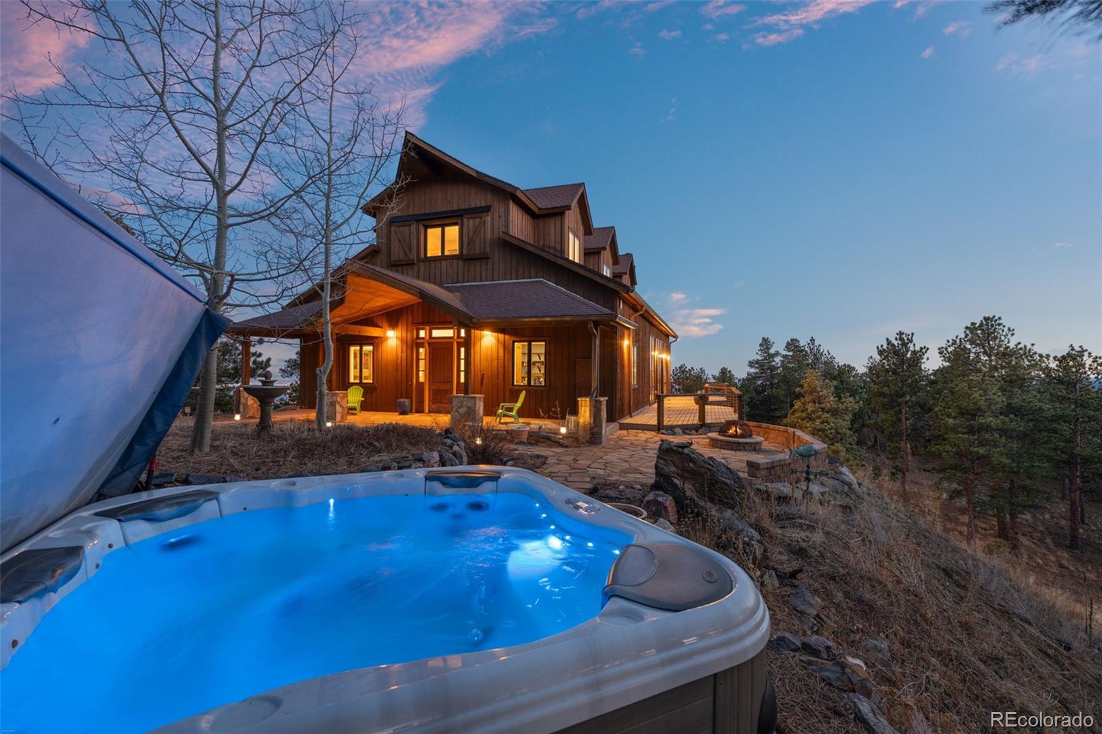 27659 Misty Road Golden, CO 80403 - Photo 23 of 50 a view of a chairs and table in the patio