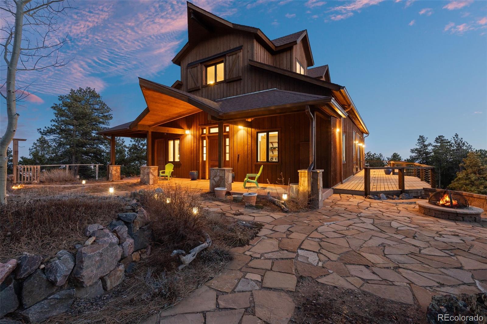 27659 Misty Road Golden, CO 80403 - Photo 24 of 50 a view of swimming pool with lawn chairs and plants