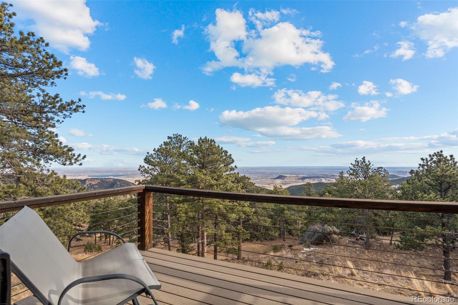 27659 Misty Road Golden, CO 80403 - Photo 26 of 50 a view of a balcony next to a yard