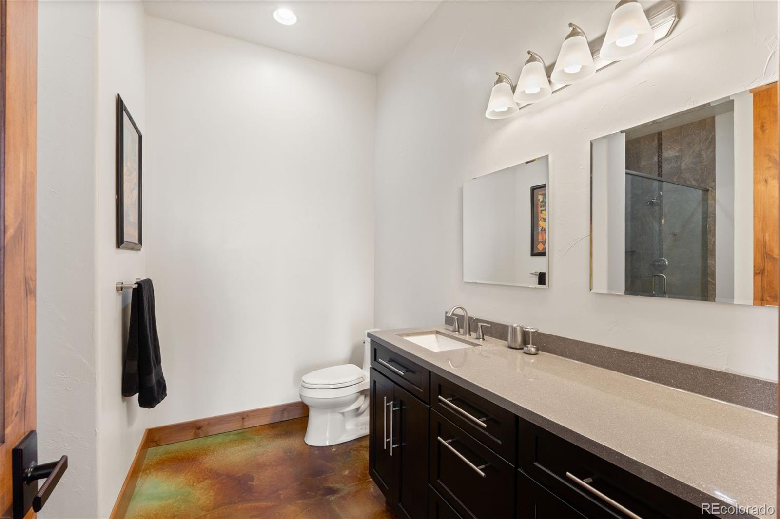 27659 Misty Road Golden, CO 80403 - Photo 28 of 50 a bathroom with a sink and a mirror
