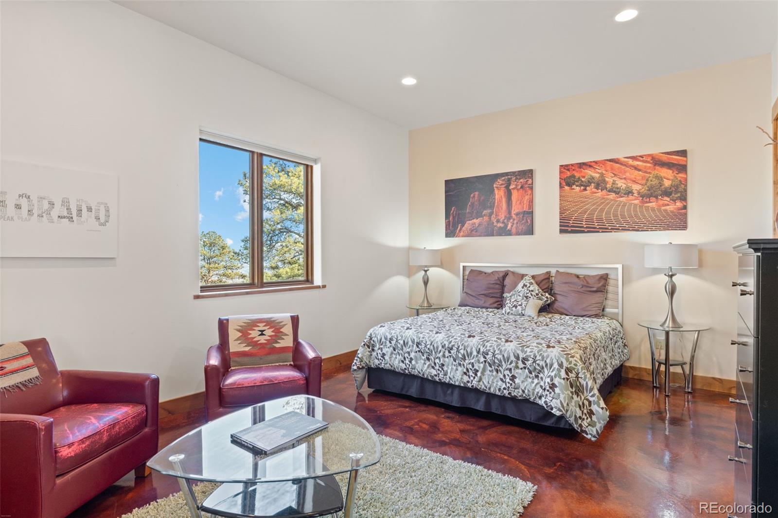 27659 Misty Road Golden, CO 80403 - Photo 29 of 50 a bedroom with a bed and wooden floor