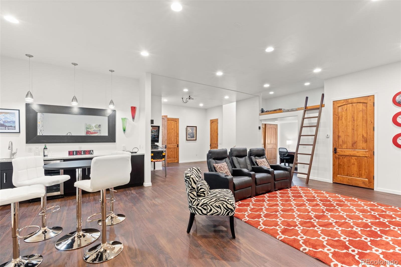 27659 Misty Road Golden, CO 80403 - Photo 39 of 50 a living room with furniture and a flat screen tv