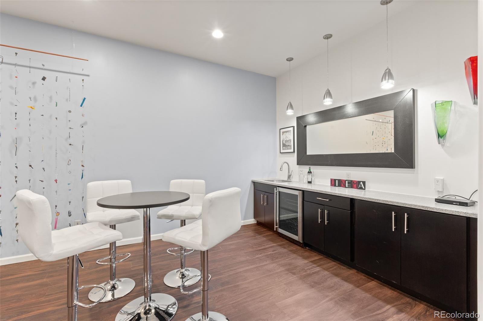 27659 Misty Road Golden, CO 80403 - Photo 41 of 50 a room with furniture and wooden floor
