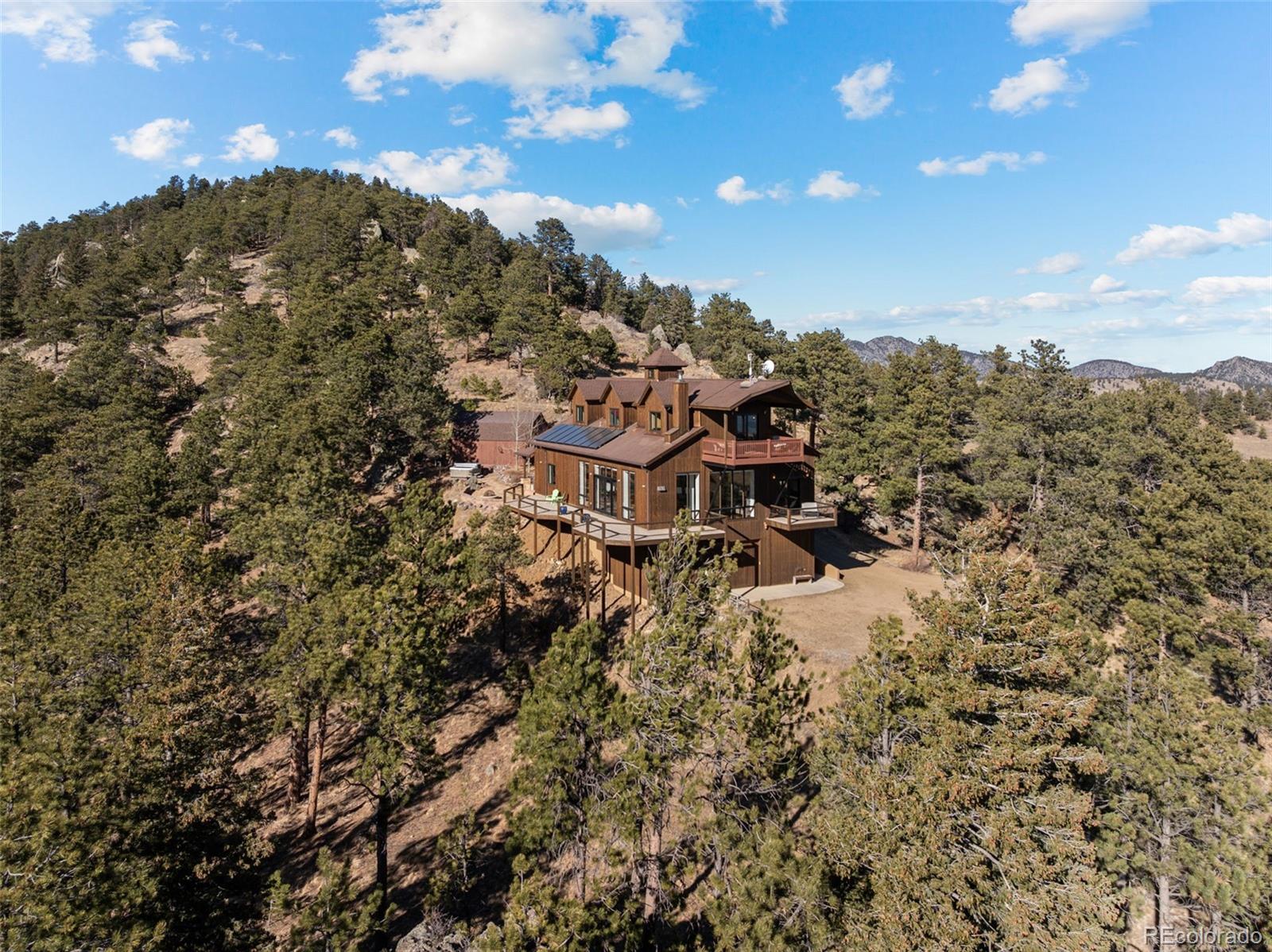 27659 Misty Road Golden, CO 80403 - Photo 46 of 50 a view of a houses with a yard