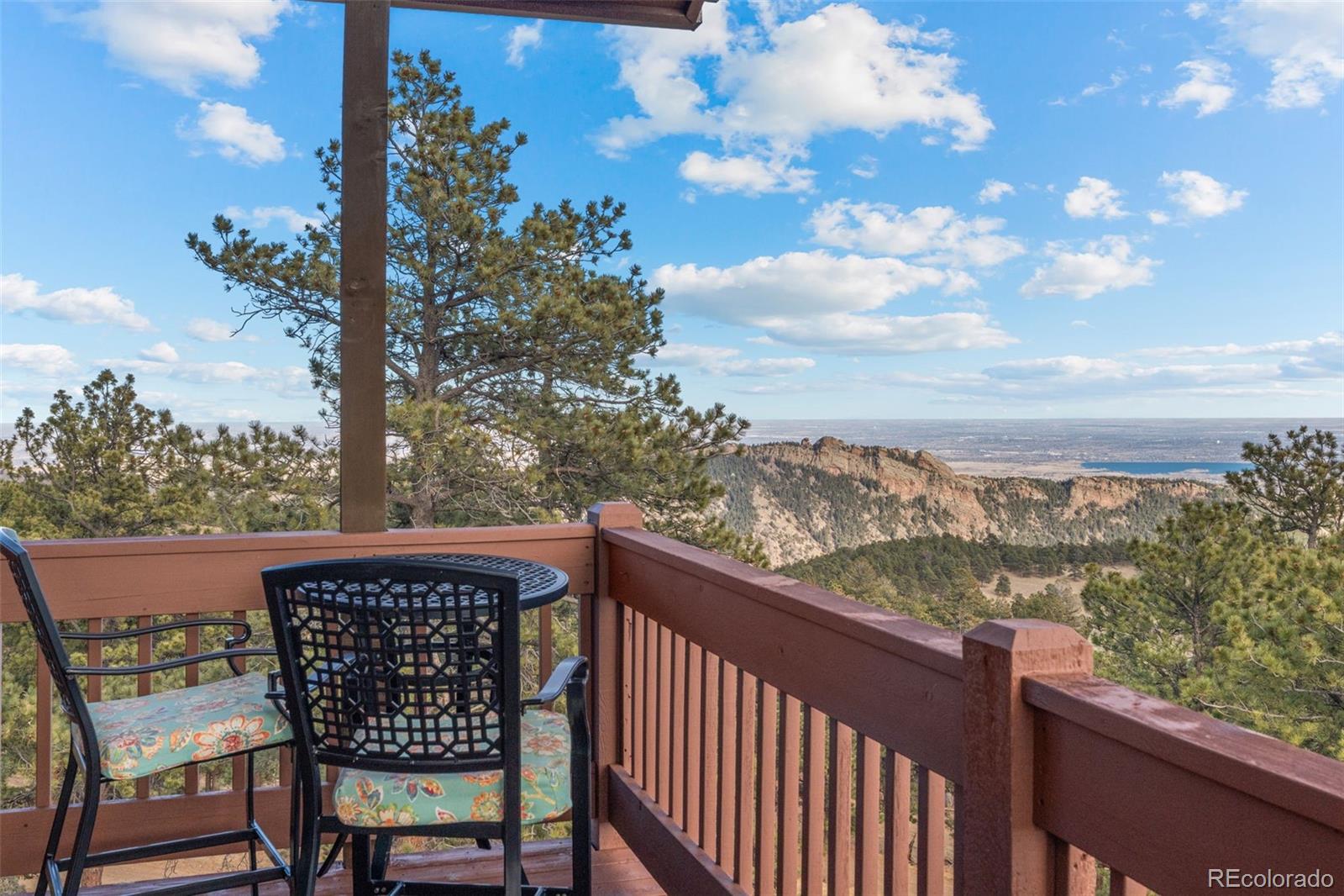 27659 Misty Road Golden, CO 80403 - Photo 5 of 50 a view of a chairs and a table in the balcony