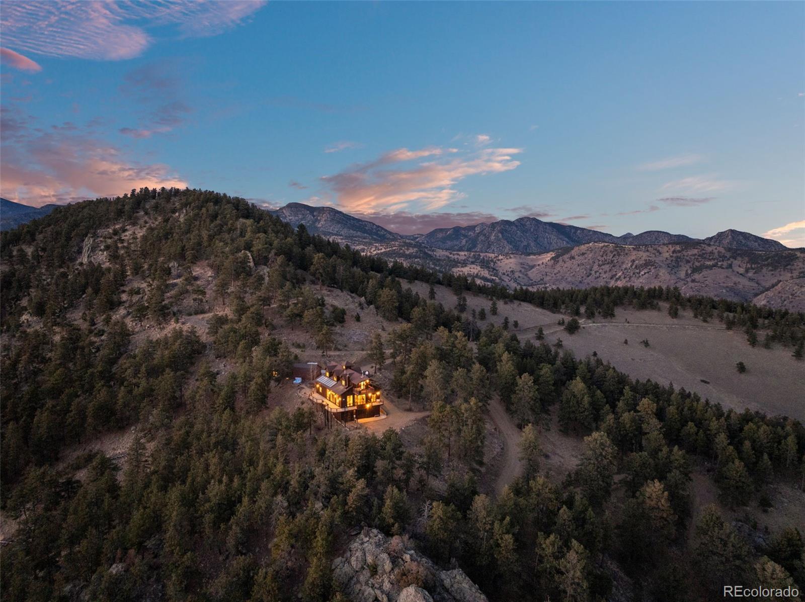 27659 Misty Road Golden, CO 80403 - Photo 7 of 50 a view of a backyard with green space