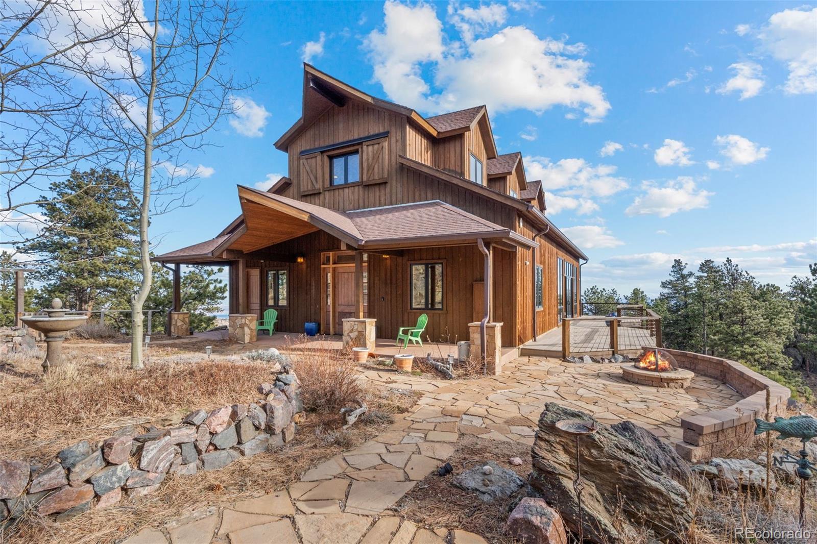 27659 Misty Road Golden, CO 80403 - Photo 9 of 50 a view of a cafe with sitting area