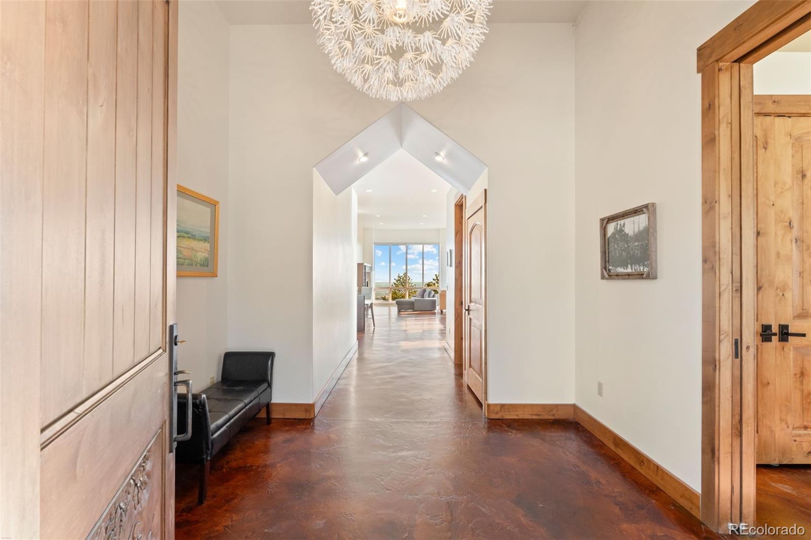 27659 Misty Road Golden, CO 80403 - Photo 10 of 50 a view of a hallway view with living room and workspace
