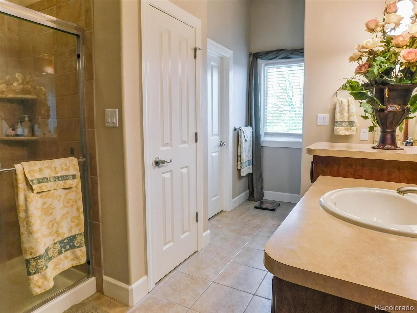 4351 Little Burnt Mill Road Pueblo, CO 81004 - Photo 14 of 45 a bathroom with a sink a toilet and shower