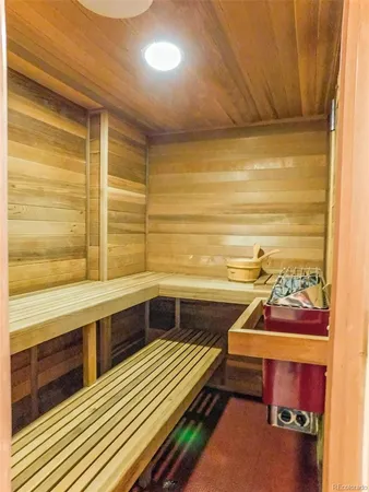 a balcony with hardwood filled with table and chairs