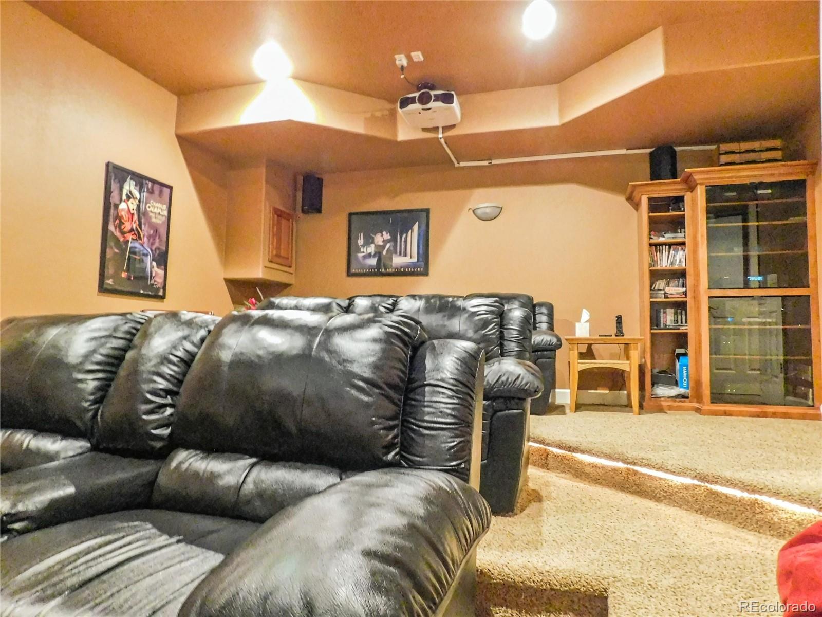 4351 Little Burnt Mill Road Pueblo, CO 81004 - Photo 25 of 45 a living room with a couch and a flat screen tv