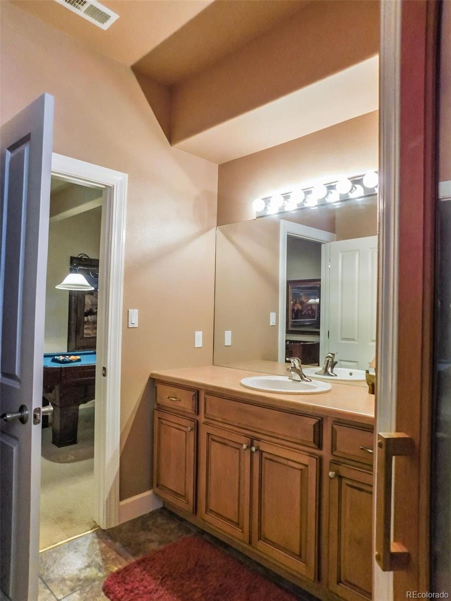 4351 Little Burnt Mill Road Pueblo, CO 81004 - Photo 27 of 45 a bathroom with a sink and a mirror