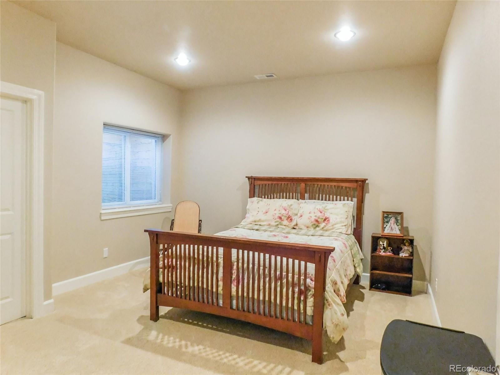 4351 Little Burnt Mill Road Pueblo, CO 81004 - Photo 28 of 45 a bedroom with a bed and a window