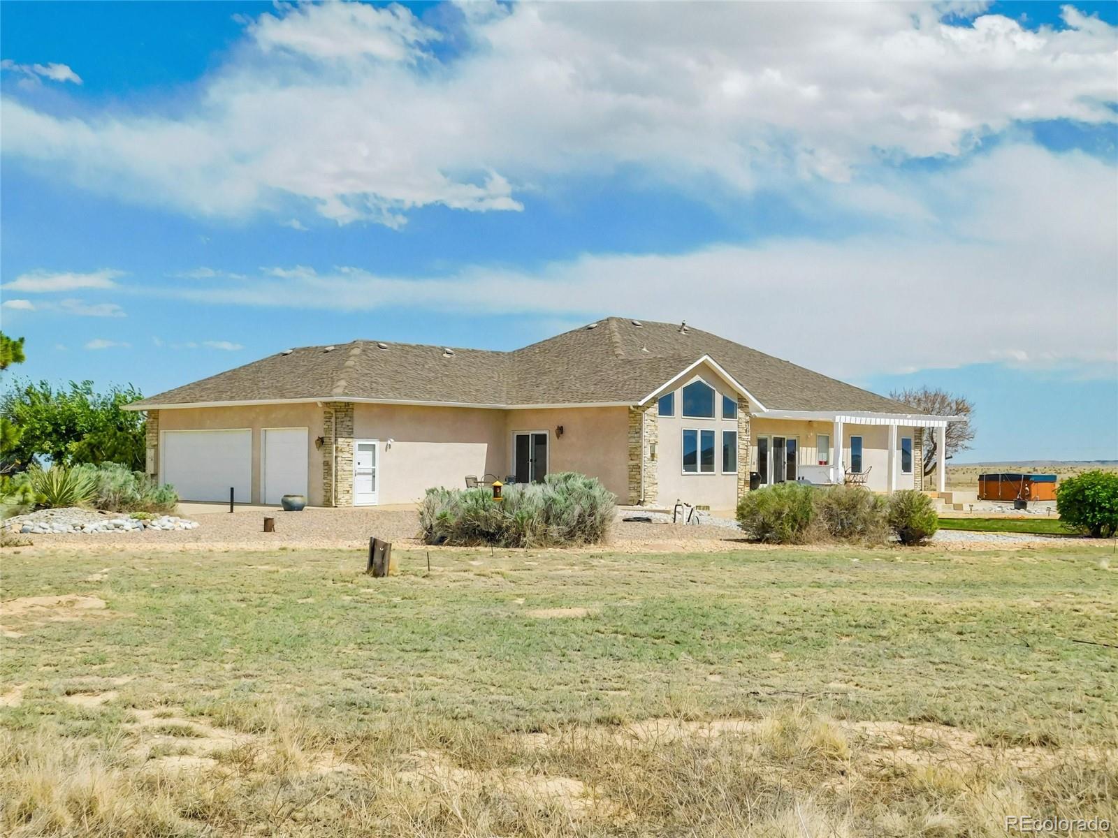 4351 Little Burnt Mill Road Pueblo, CO 81004 - Photo 32 of 45 a front view of a house with a yard