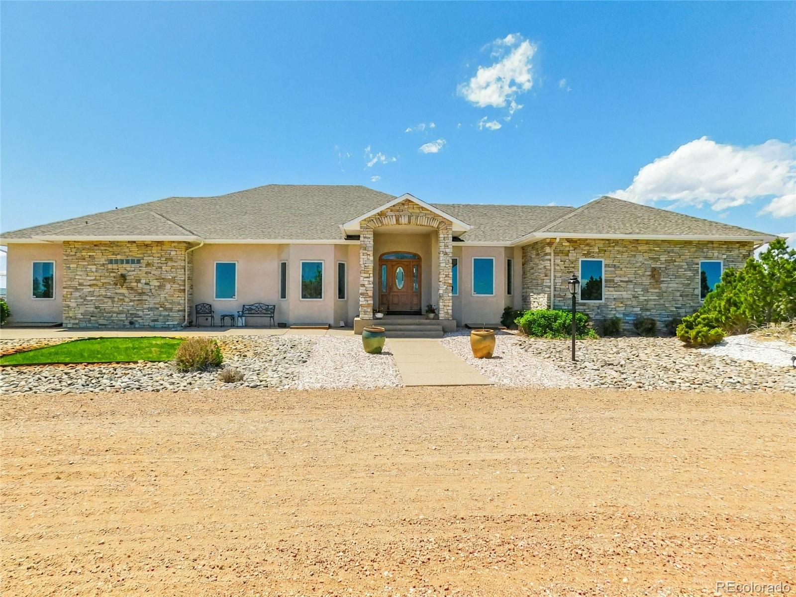 4351 Little Burnt Mill Road Pueblo, CO 81004 - Photo 33 of 45 a front view of a house with a yard