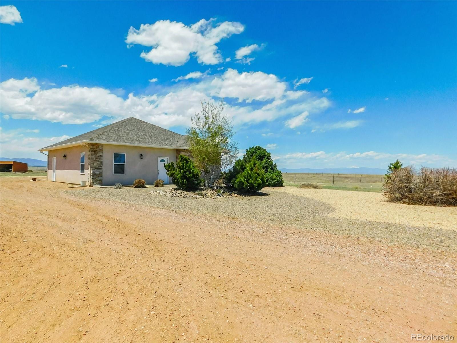 4351 Little Burnt Mill Road Pueblo, CO 81004 - Photo 37 of 45 a view of a house with a yard