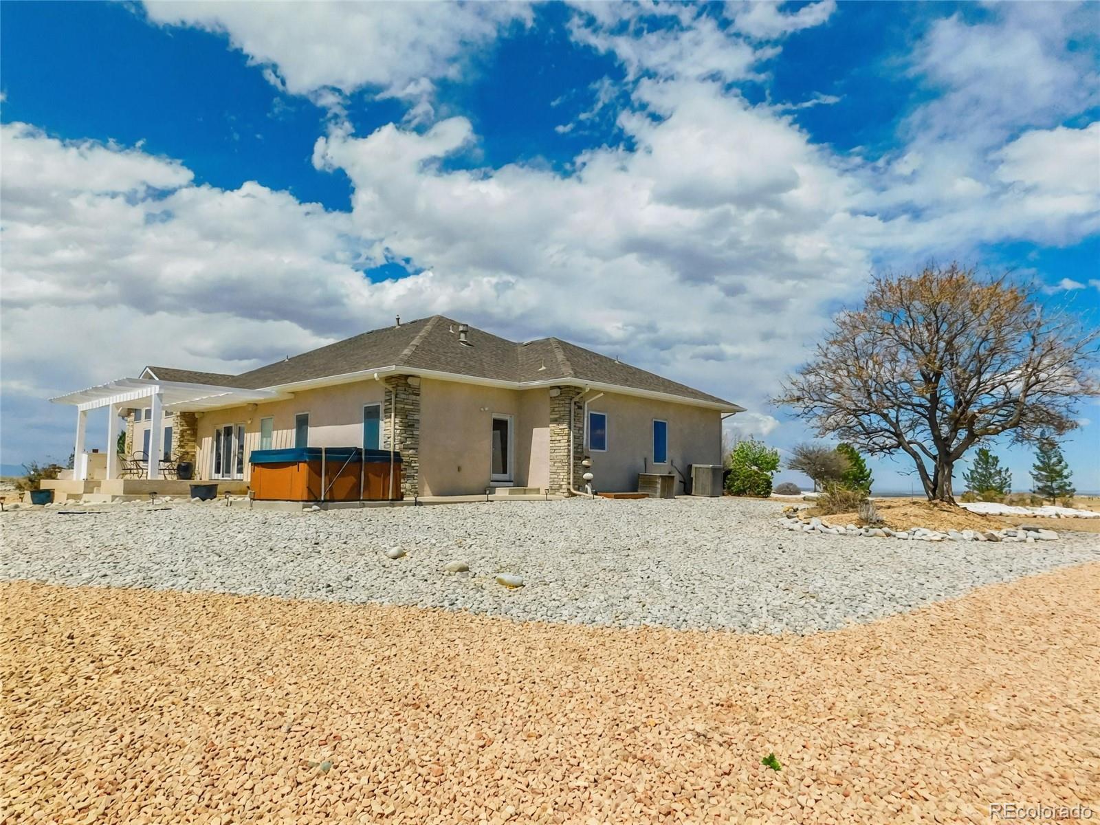 4351 Little Burnt Mill Road Pueblo, CO 81004 - Photo 39 of 45 a front view of a house with a yard