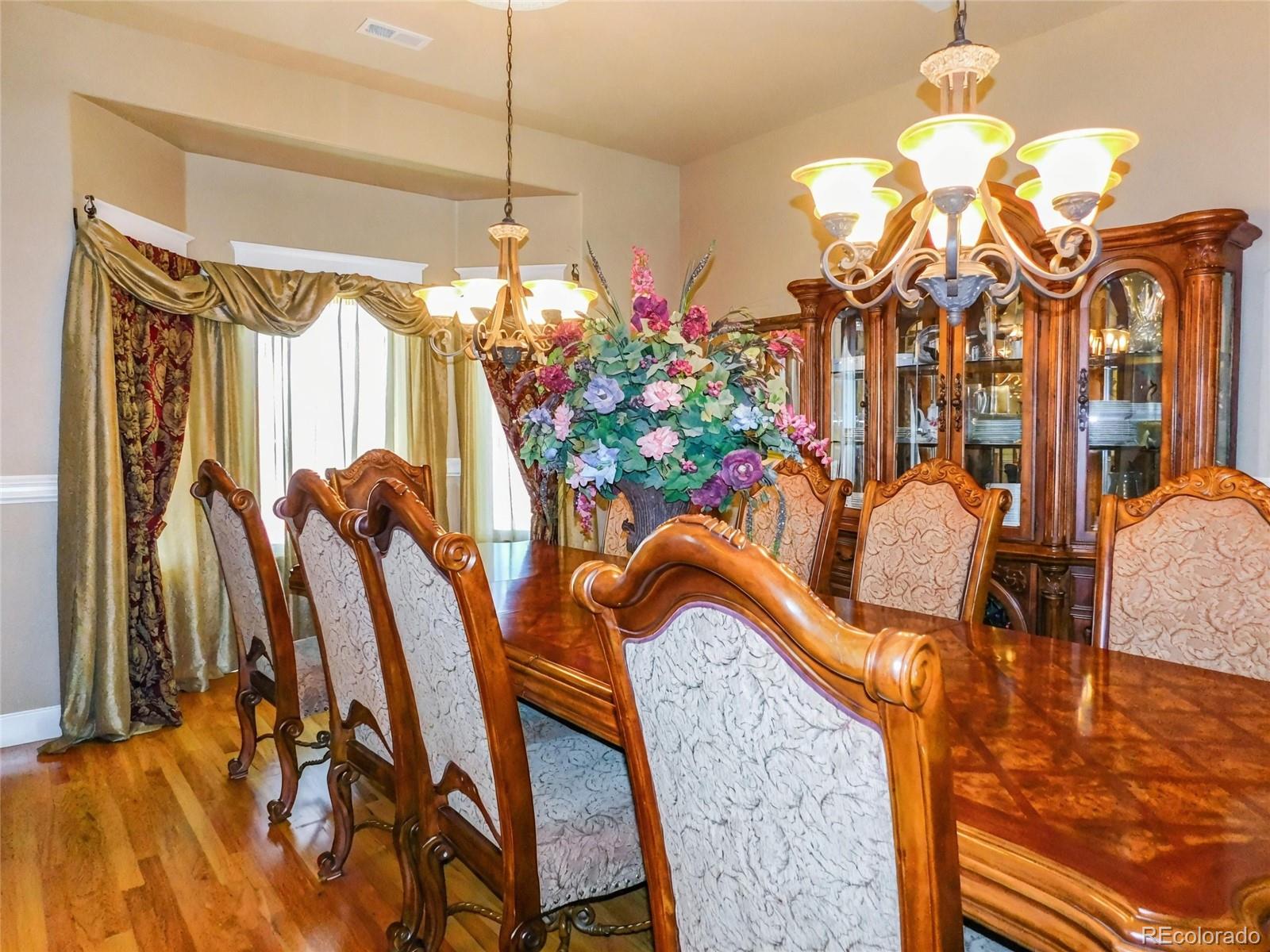 4351 Little Burnt Mill Road Pueblo, CO 81004 - Photo 4 of 45 a view of a dining room with furniture and chandelier