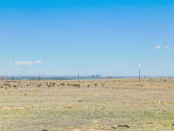 a view of a lake with a big yard
