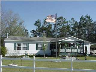 4397 Rebecca Road Crestview, FL 32539 - Photo 1 of 16 a front view of a house with a yard