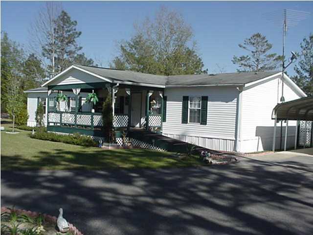 4397 Rebecca Road Crestview, FL 32539 - Photo 13 of 16 a front view of a house with a yard
