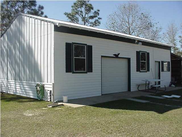 4397 Rebecca Road Crestview, FL 32539 - Photo 2 of 16 a backyard of a house