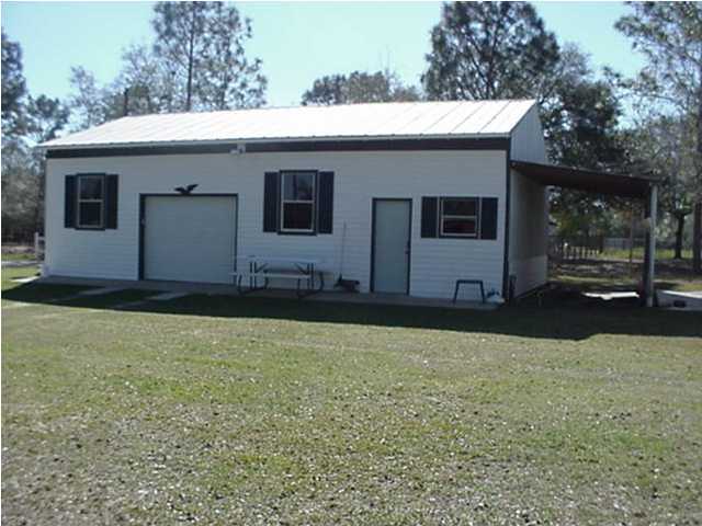 4397 Rebecca Road Crestview, FL 32539 - Photo 3 of 16 a view of a house with a backyard