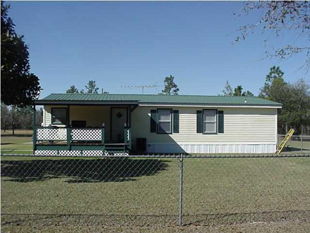 4397 Rebecca Road Crestview, FL 32539 - Photo 4 of 16 a front view of a house with a garage