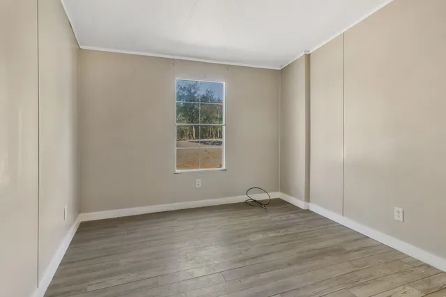 a view of a house with a yard and a sitting area