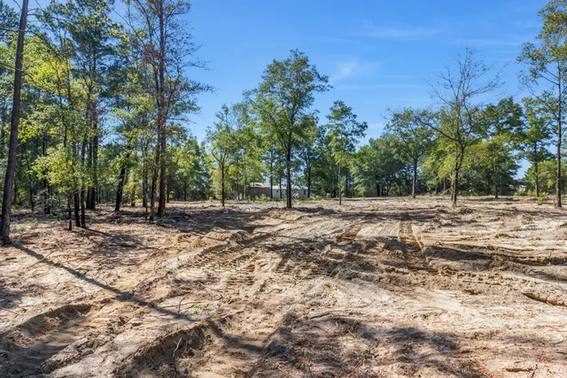a view of swimming pool with seating space