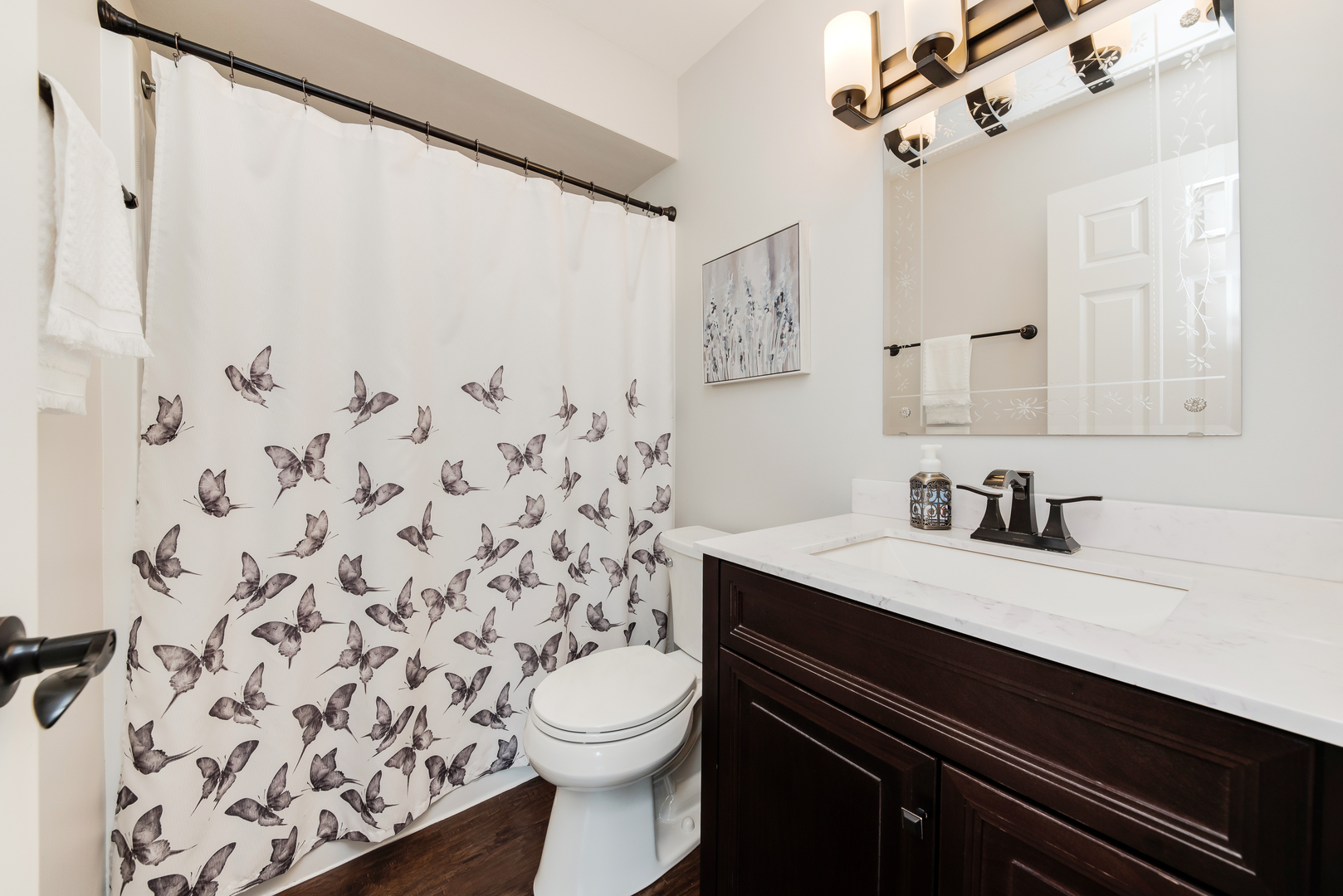 200 Beechwood Drive Minooka, IL 60447 - Photo 13 of 26 a bathroom with a granite countertop sink a toilet and a shower curtain