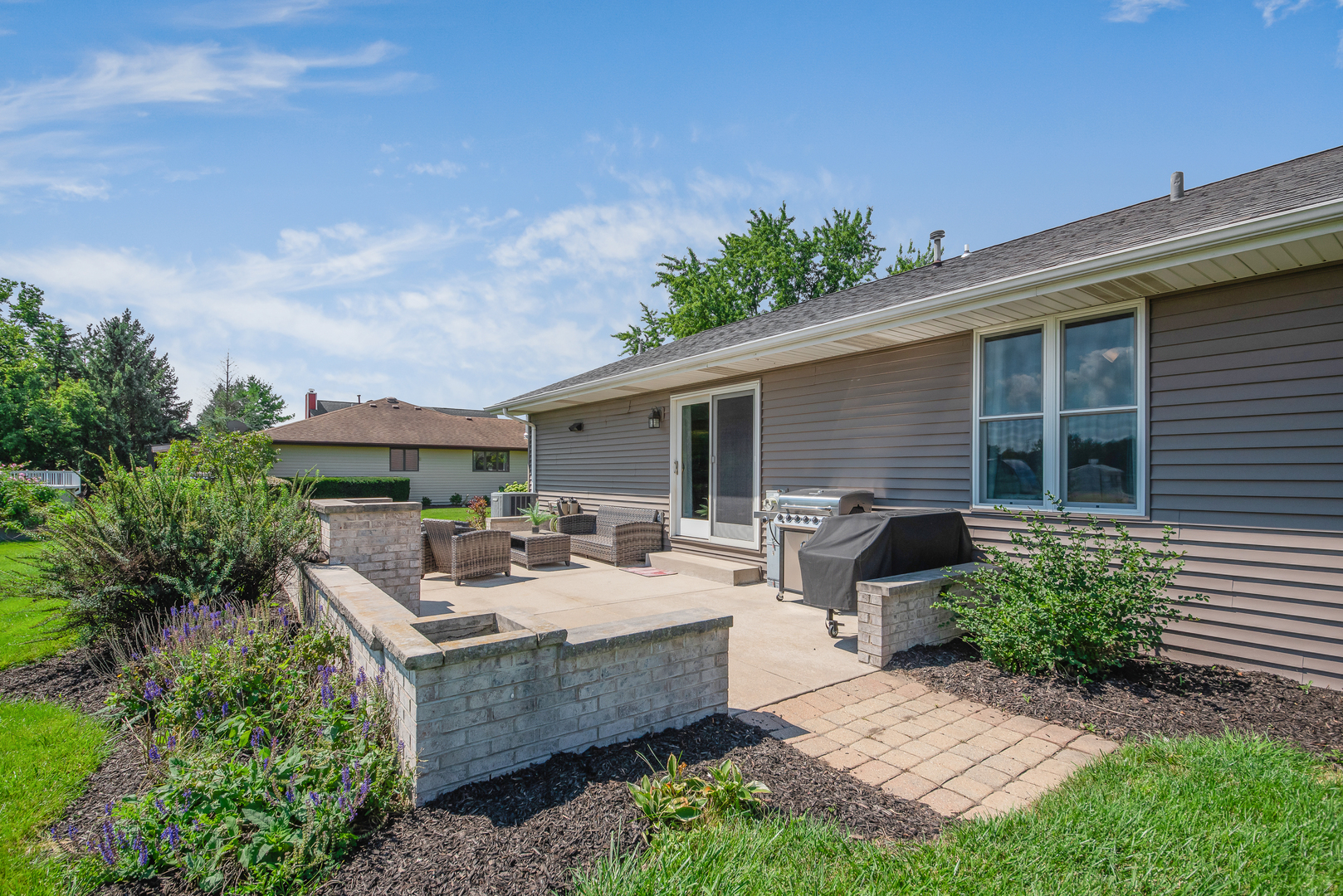 200 Beechwood Drive Minooka, IL 60447 - Photo 16 of 26 a view of a house with backyard sitting area and garden