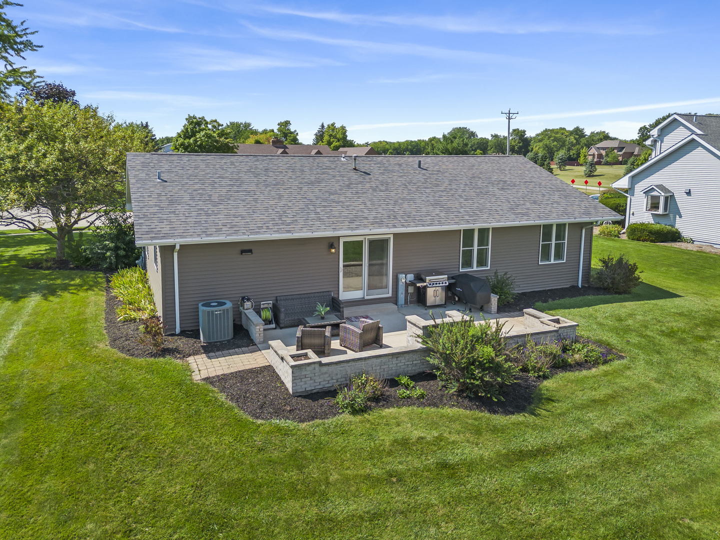 200 Beechwood Drive Minooka, IL 60447 - Photo 17 of 26 a view of a house with a yard and a garden