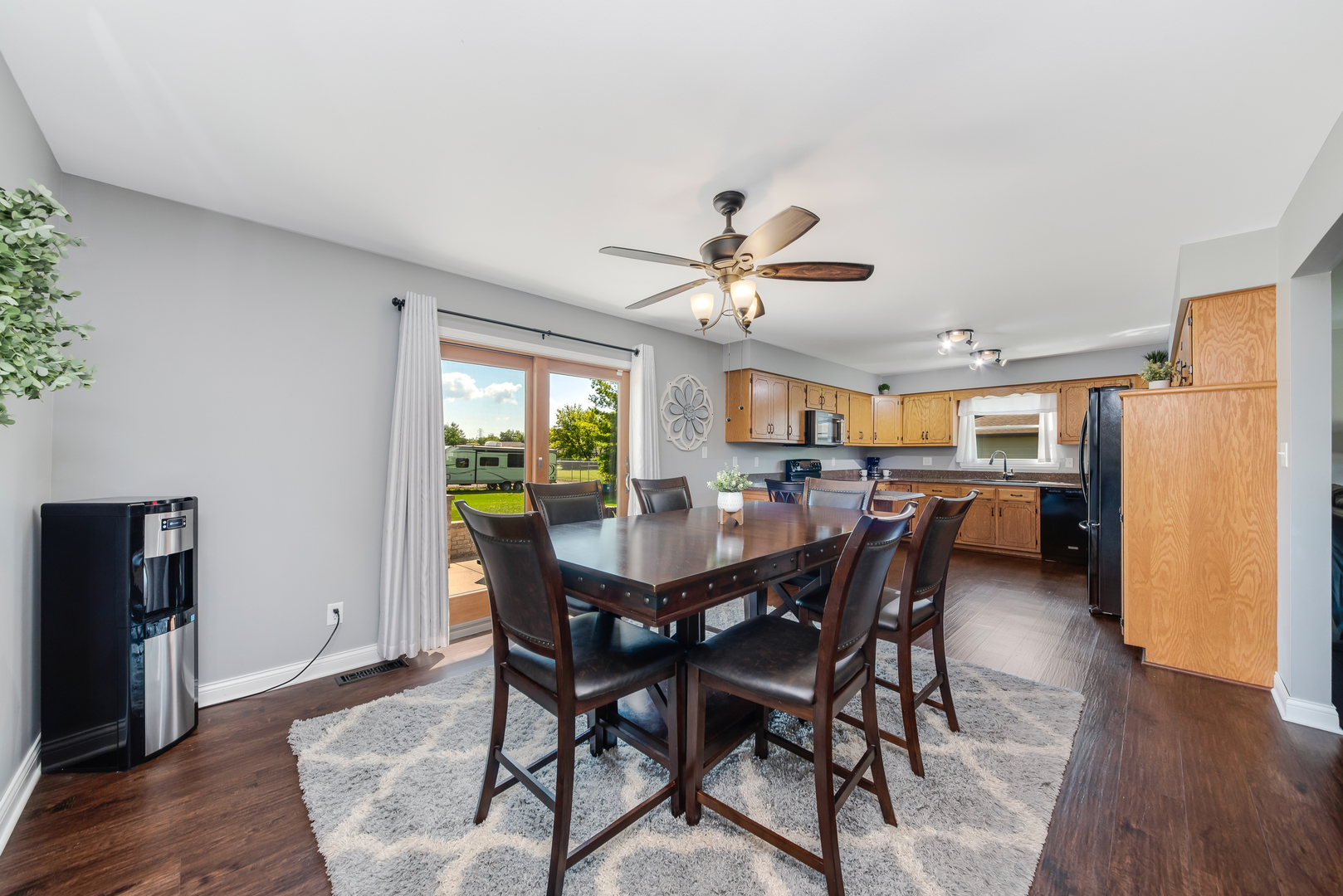 200 Beechwood Drive Minooka, IL 60447 - Photo 8 of 26 a view of a dining room with furniture and wooden floor