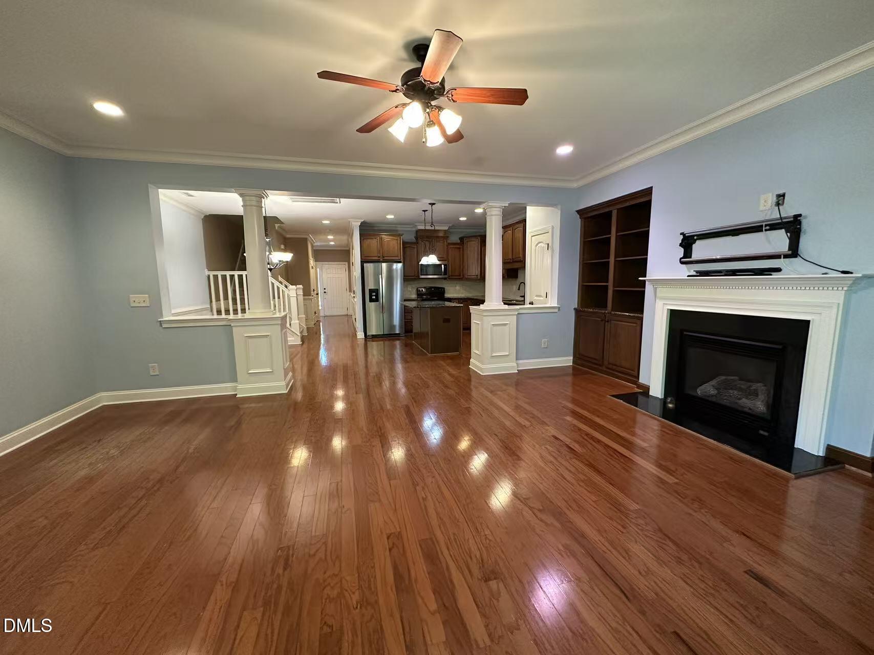 1056 Indigo Ridge Place Cary, NC 27519 - Photo 12 of 33 a view of livingroom and kitchen with wooden floor
