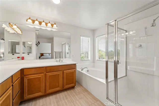 a bathroom with a sink vanity and a mirror