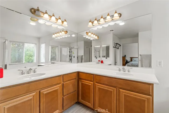 a bedroom with two beds and a couch