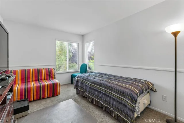 a view of a livingroom with furniture and workspace