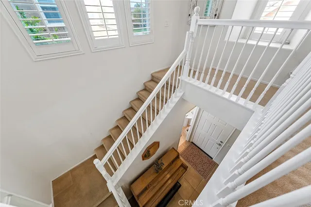 a view of staircase with white walls