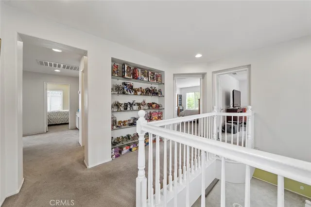 a bedroom with two beds and a window