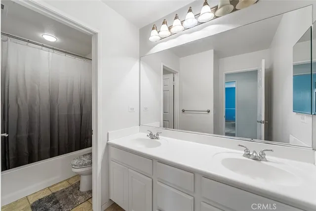 a bedroom with a bed and a desk