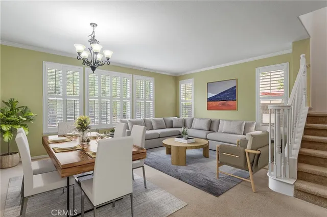 a living room with fireplace furniture and a potted plant