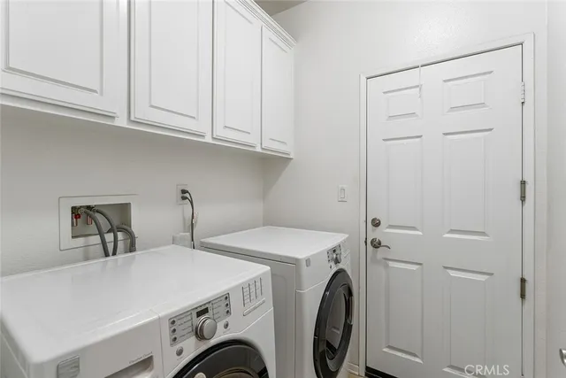 a living room with furniture a large window and a table