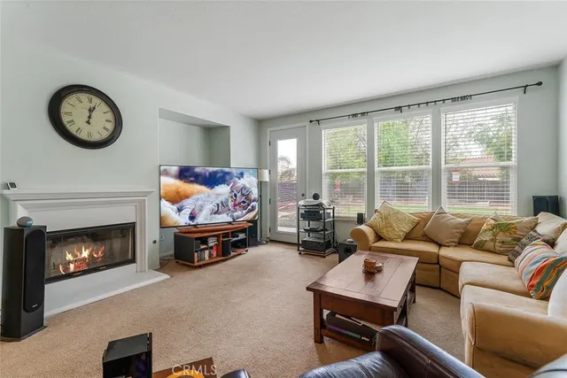 a kitchen with stainless steel appliances granite countertop a stove a sink a table and chairs