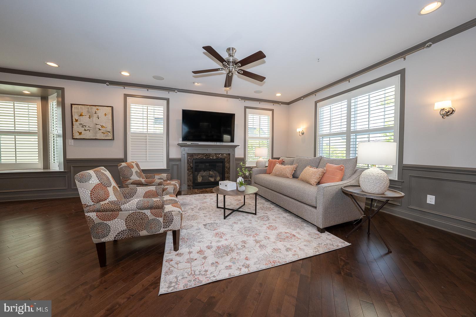 131 Spring Oak Drive Malvern, PA 19355 - Photo 13 of 93 a living room with furniture a fireplace and a flat screen tv
