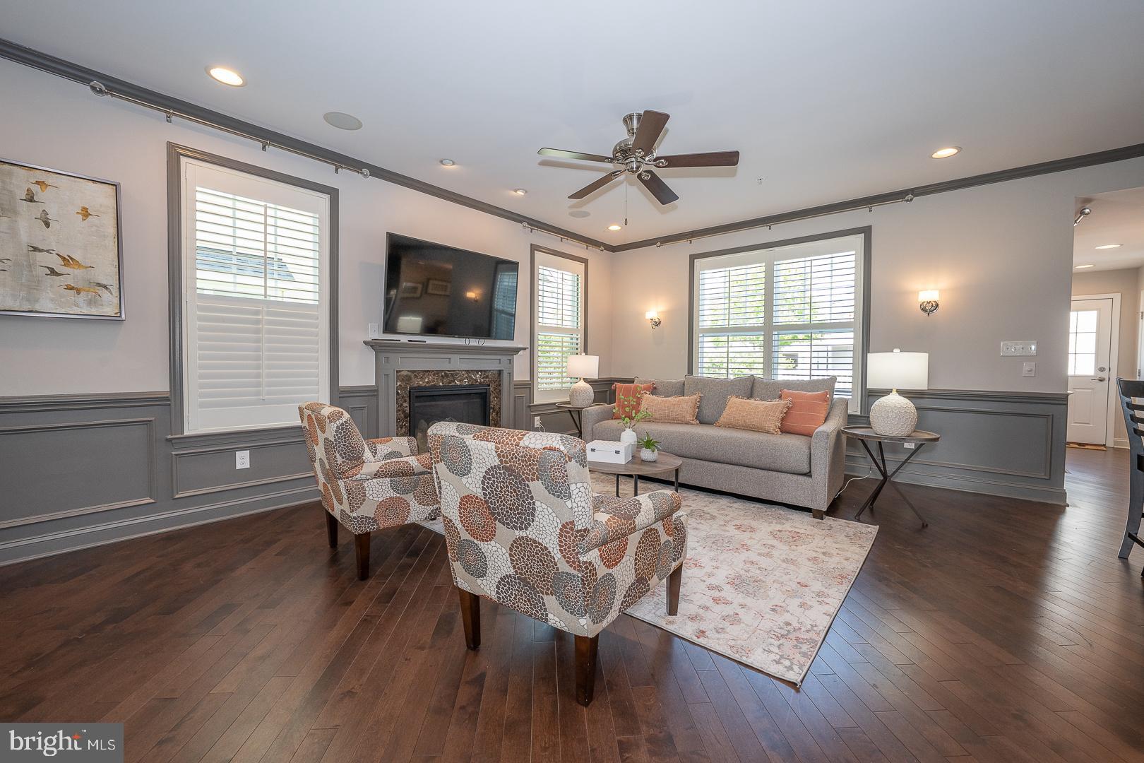 131 Spring Oak Drive Malvern, PA 19355 - Photo 14 of 93 a living room with furniture a flat screen tv and a fireplace