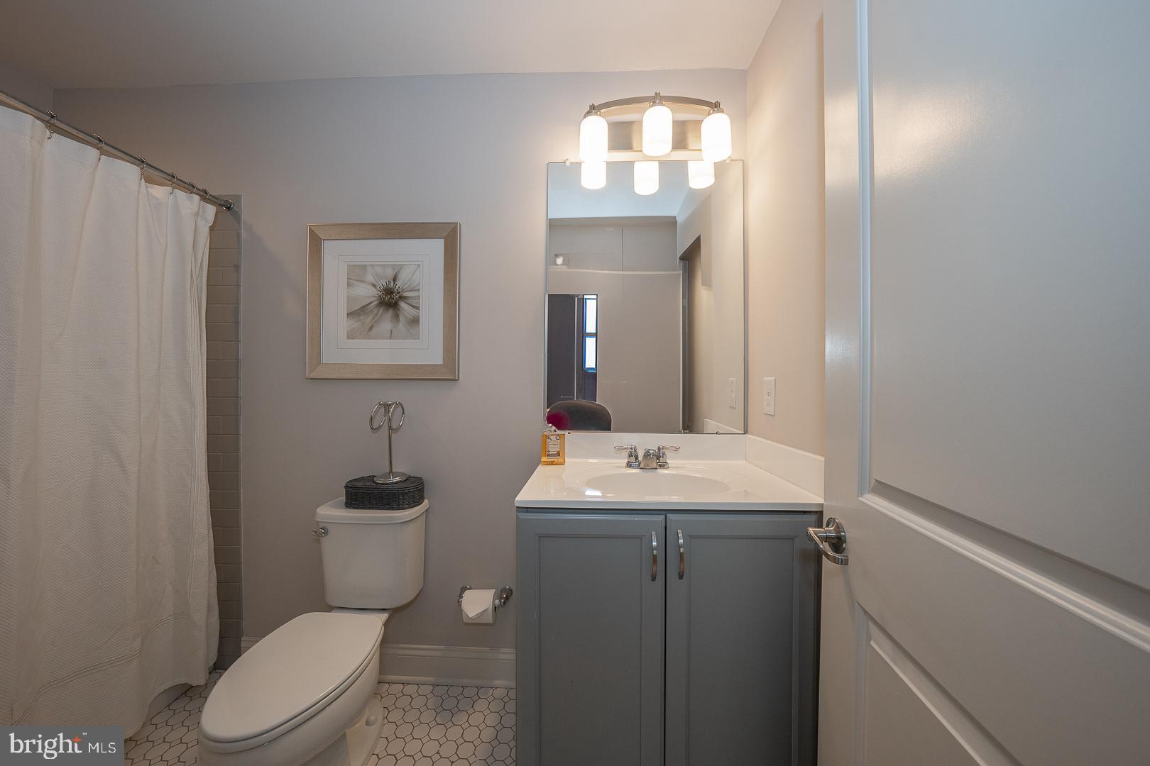 131 Spring Oak Drive Malvern, PA 19355 - Photo 54 of 93 a bathroom with a toilet a sink and mirror