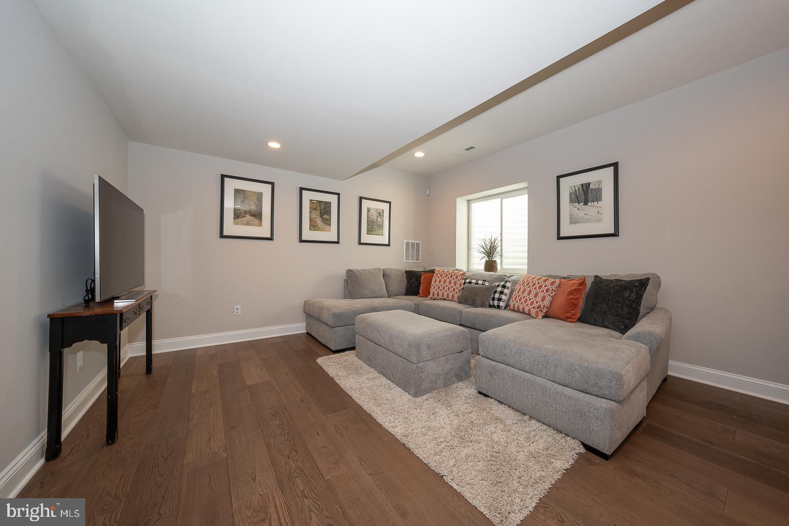 131 Spring Oak Drive Malvern, PA 19355 - Photo 56 of 93 a living room with furniture and a flat screen tv