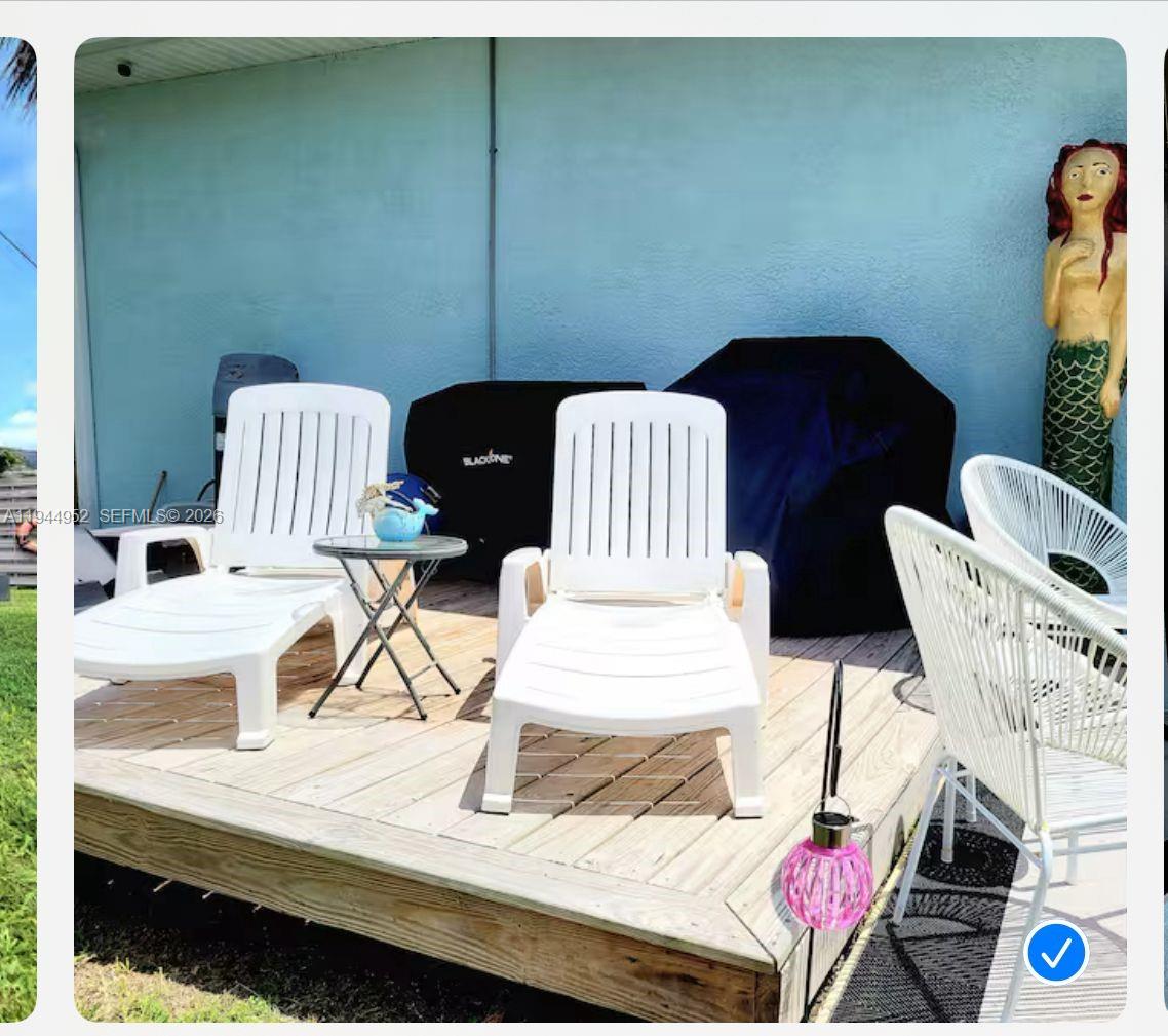 562 Flamingo Road Venice, FL 34293 - Photo 13 of 15 a view of a room that has a couch