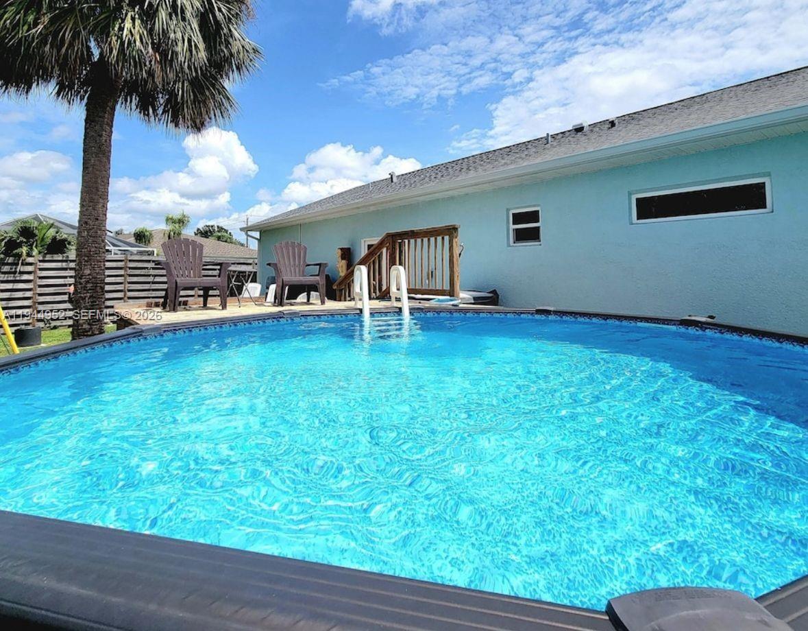 562 Flamingo Road Venice, FL 34293 - Photo 14 of 15 a view of a house with a backyard porch and sitting area